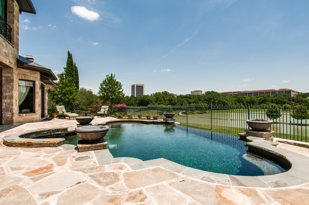 Pool - traditional backyard custom-shaped pool idea in Dallas