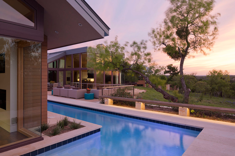 Diseño de casa de la piscina y piscina alargada contemporánea extra grande a medida en patio