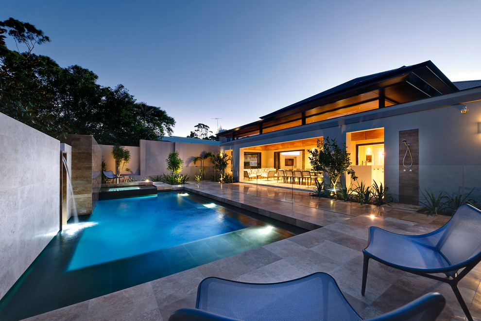 Design ideas for a contemporary back rectangular swimming pool in Perth with fencing.