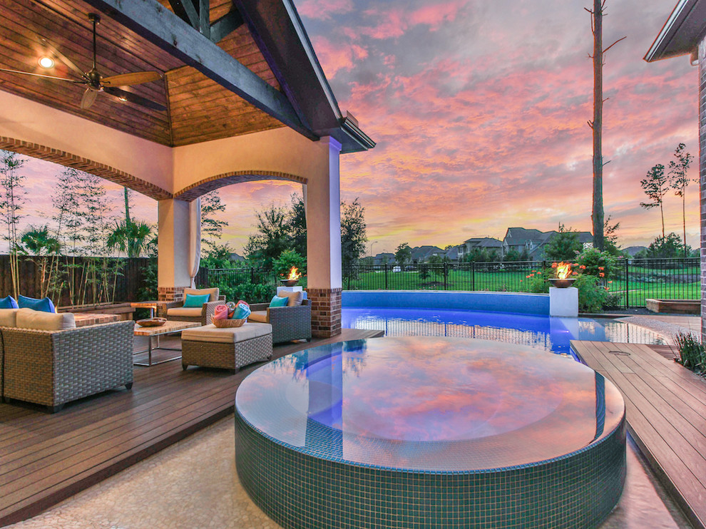 Inspiration for a large transitional backyard concrete and rectangular natural hot tub remodel in Houston