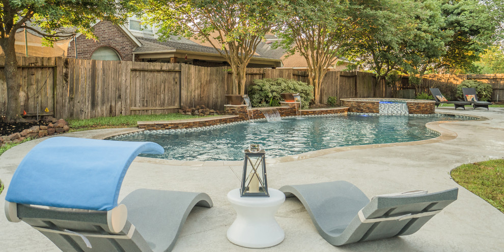 Pool fountain - mid-sized contemporary backyard tile and custom-shaped pool fountain idea in Houston