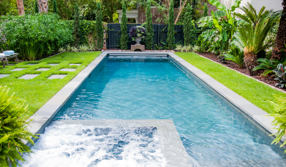 Large traditional back rectangular lengths swimming pool in Charleston with concrete paving.