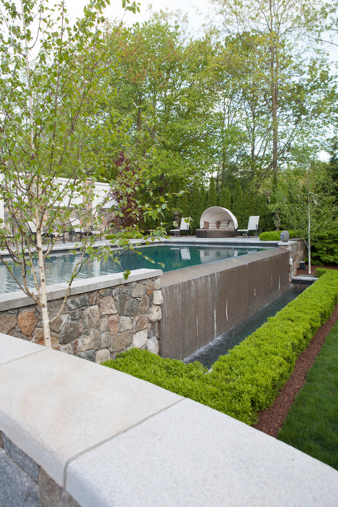 Ispirazione per una piscina fuori terra classica rettangolare con fontane