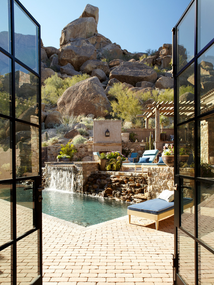 Inspiration for a mediterranean swimming pool in Phoenix.