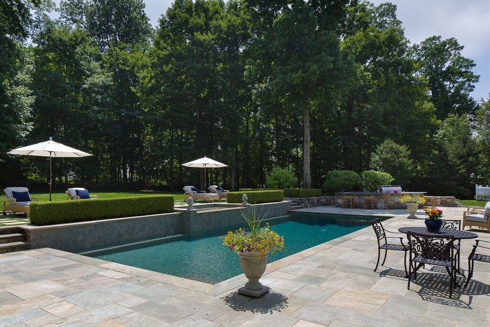 Inspiration for a mid-sized transitional backyard stone and rectangular lap hot tub remodel in New York