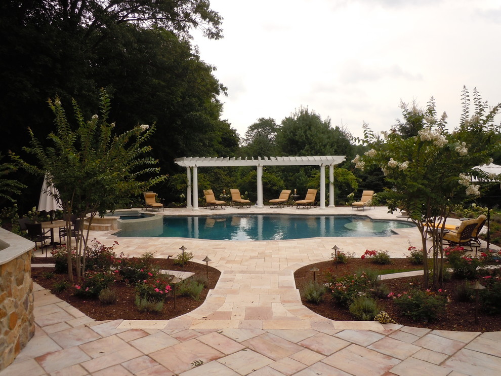 Large trendy backyard concrete paver and custom-shaped natural hot tub photo in New York