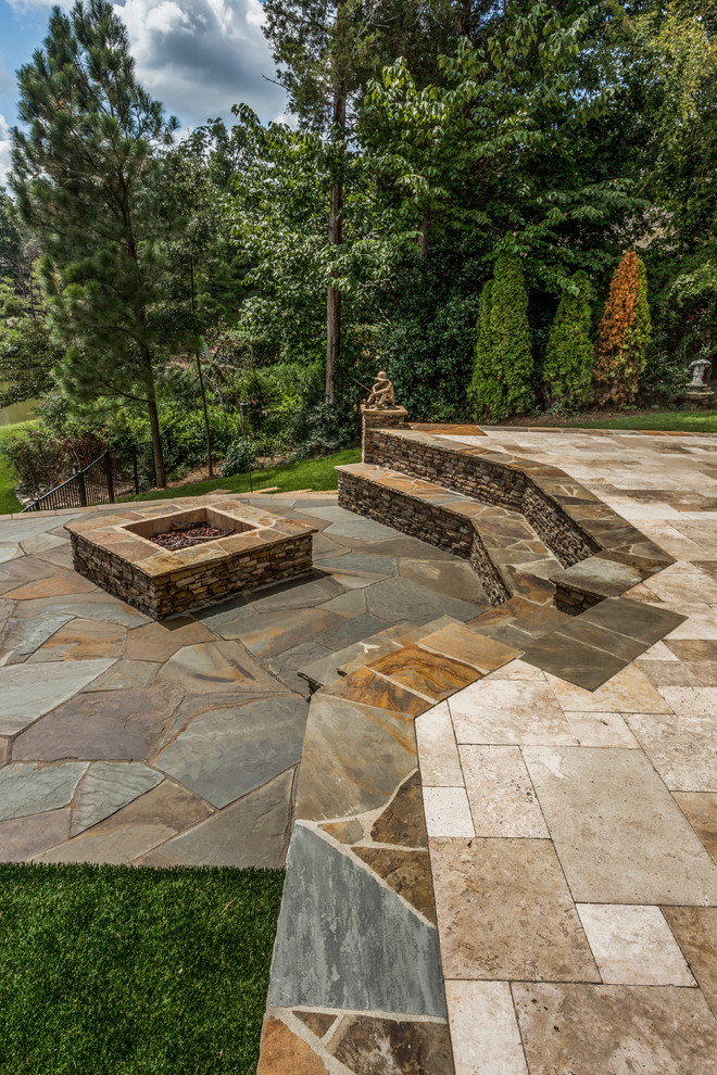 Example of a mid-sized classic backyard tile and custom-shaped hot tub design in Charlotte