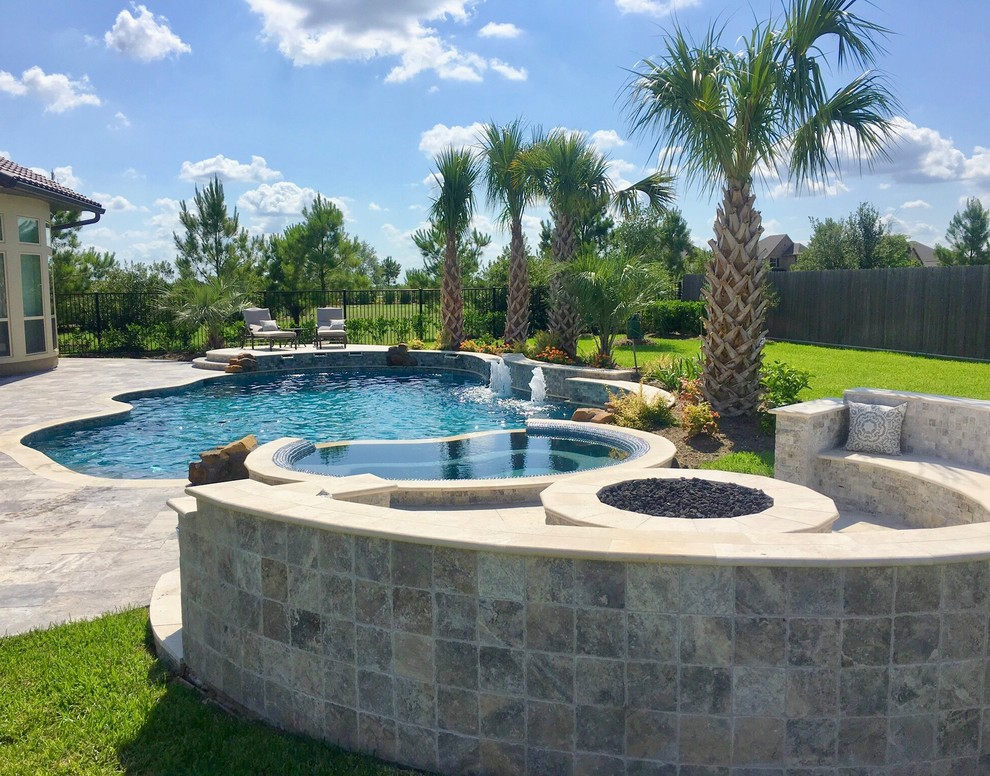 Inspiration for a back custom shaped swimming pool in Houston.