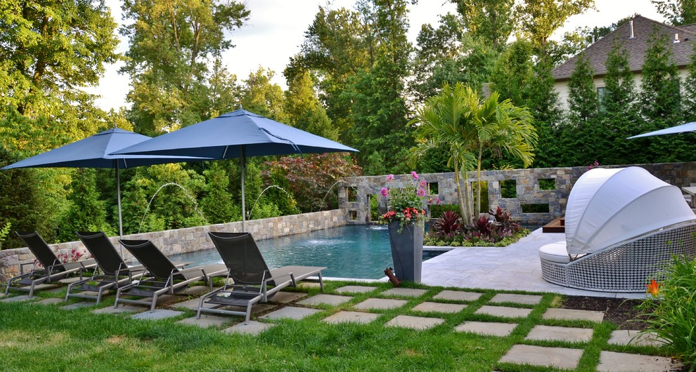 Photo of a medium sized world-inspired back l-shaped swimming pool in New York with tiled flooring.