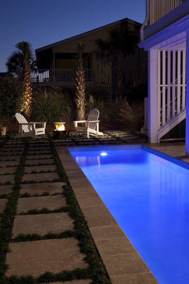 Example of a minimalist stone and custom-shaped pool design in Wilmington