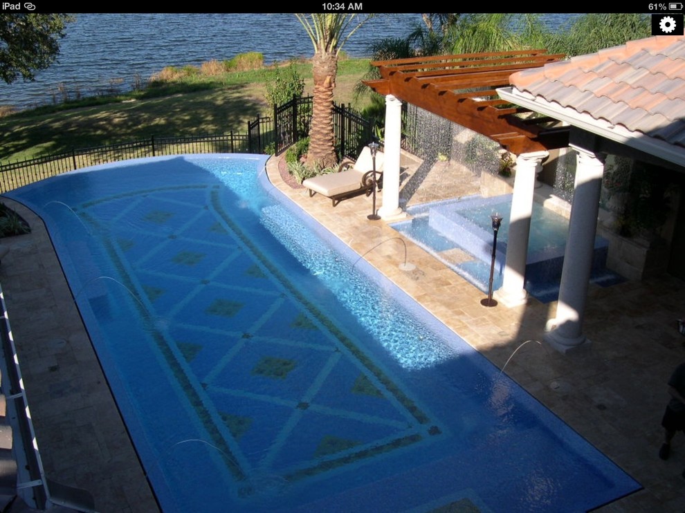 Photo of a mediterranean swimming pool in Miami.