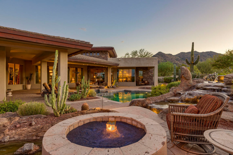 Patio - mid-sized southwestern backyard brick patio idea in Phoenix