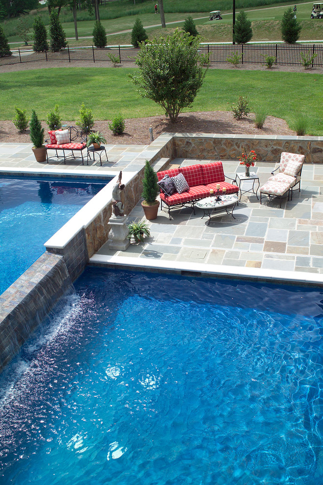 Inspiration for a timeless backyard concrete paver pool fountain remodel in Raleigh