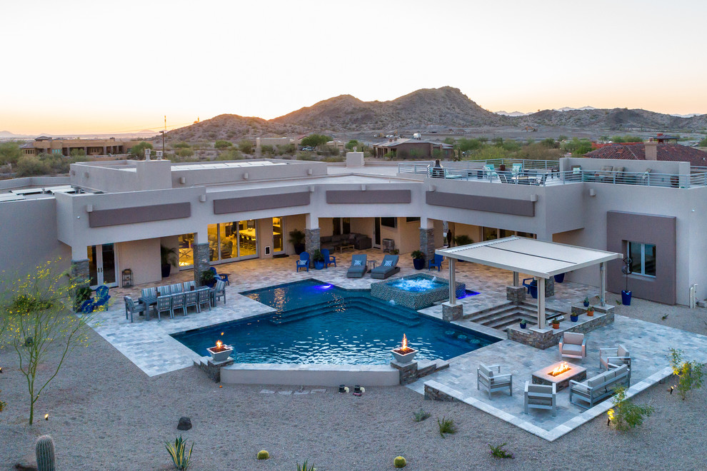 Large trendy backyard tile and custom-shaped hot tub photo in Phoenix