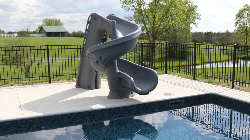 Idée de décoration pour une grande piscine arrière minimaliste rectangle avec une dalle de béton.