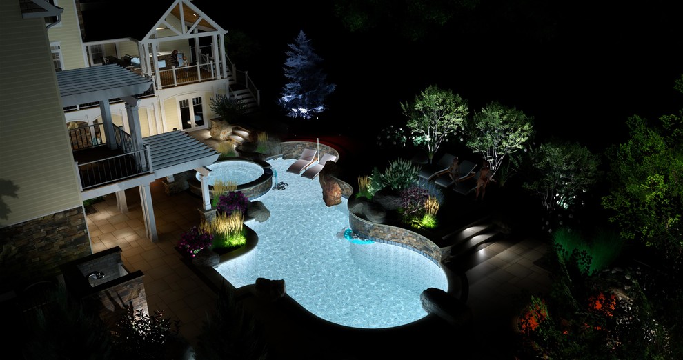 Idee per una grande piscina naturale boho chic personalizzata dietro casa con un acquascivolo e pavimentazioni in cemento