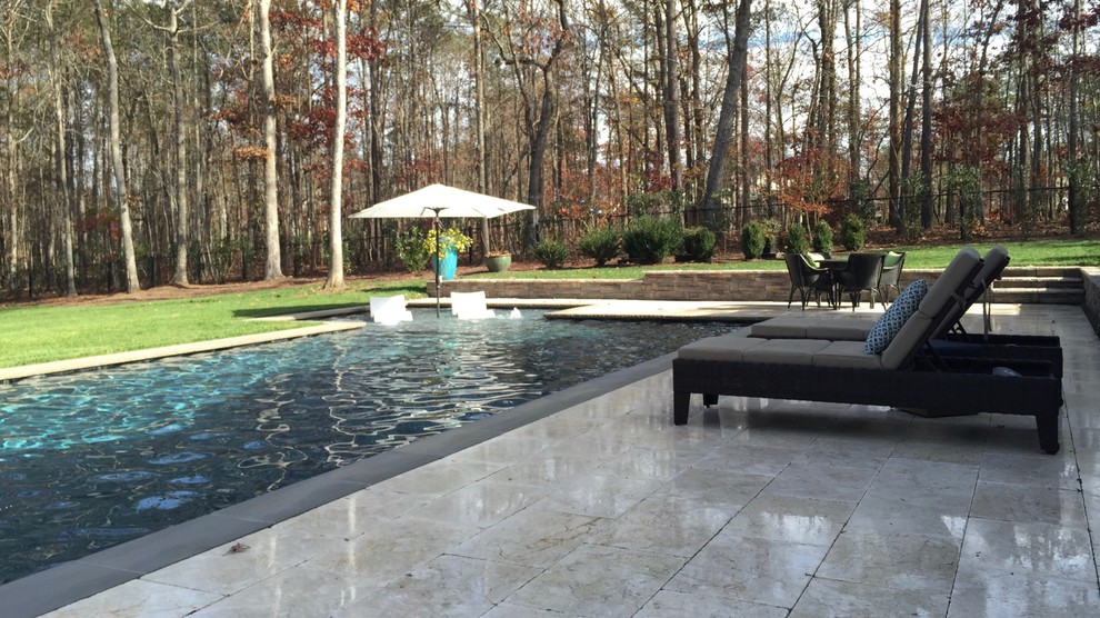 This is an example of a large rural back rectangular lengths hot tub in Raleigh.