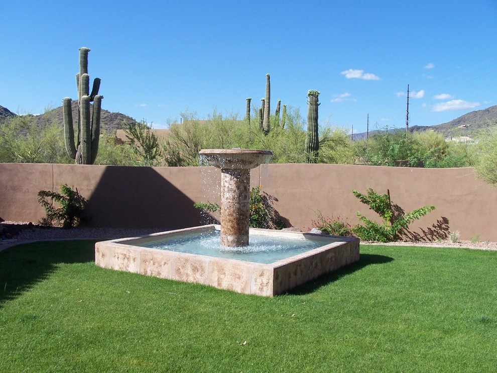 Hot tub - southwestern backyard concrete paver hot tub idea in Phoenix