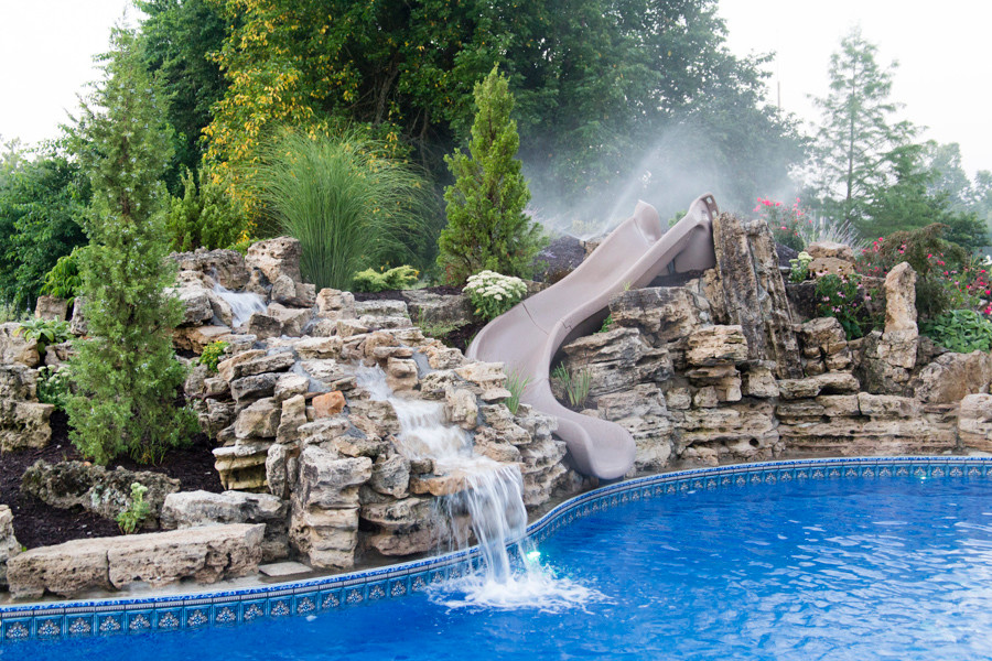 Inspiration for a large craftsman backyard custom-shaped natural pool fountain remodel in Other