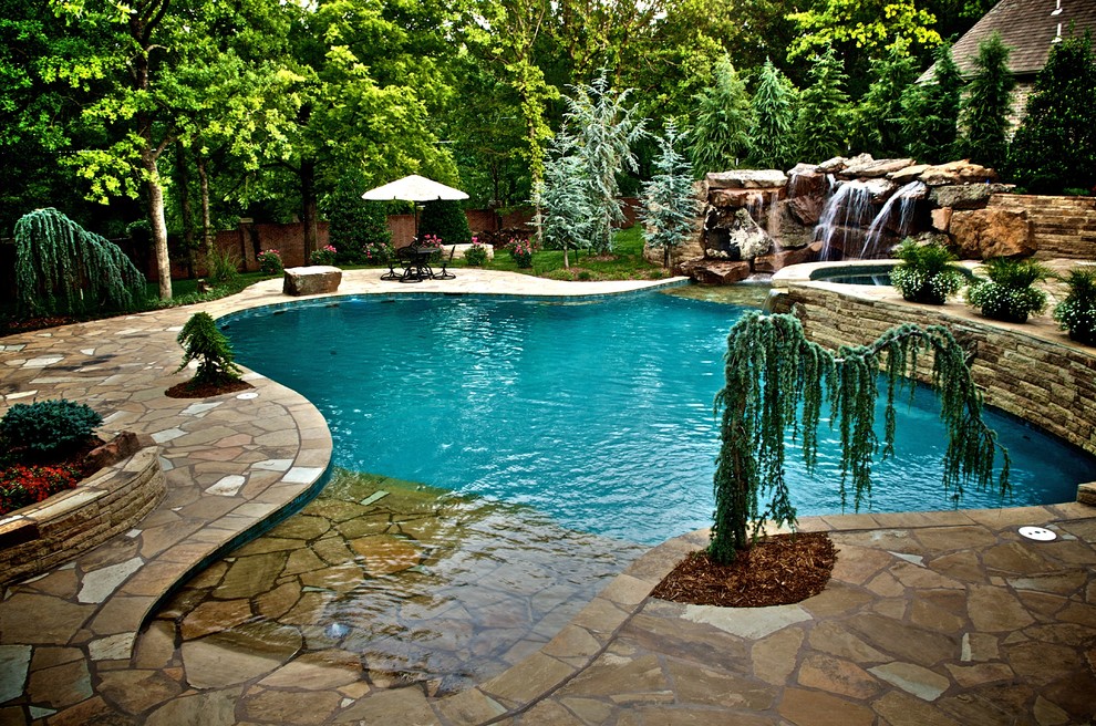 Example of a tuscan custom-shaped pool design in Oklahoma City
