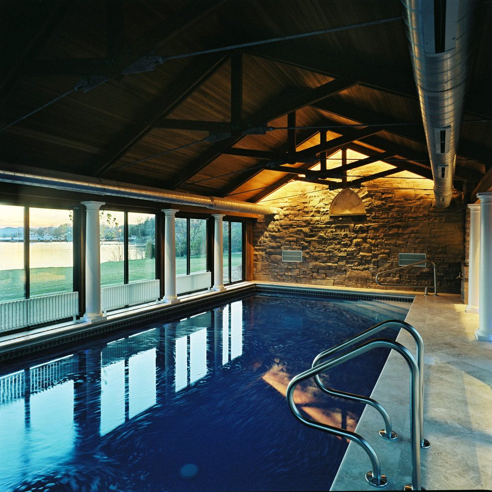 Inspiration for a mid-sized mediterranean indoor stone and rectangular pool remodel in Burlington
