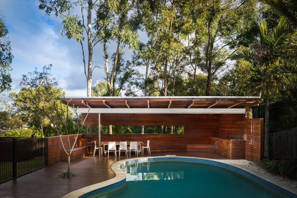 Medium sized contemporary swimming pool in Brisbane.