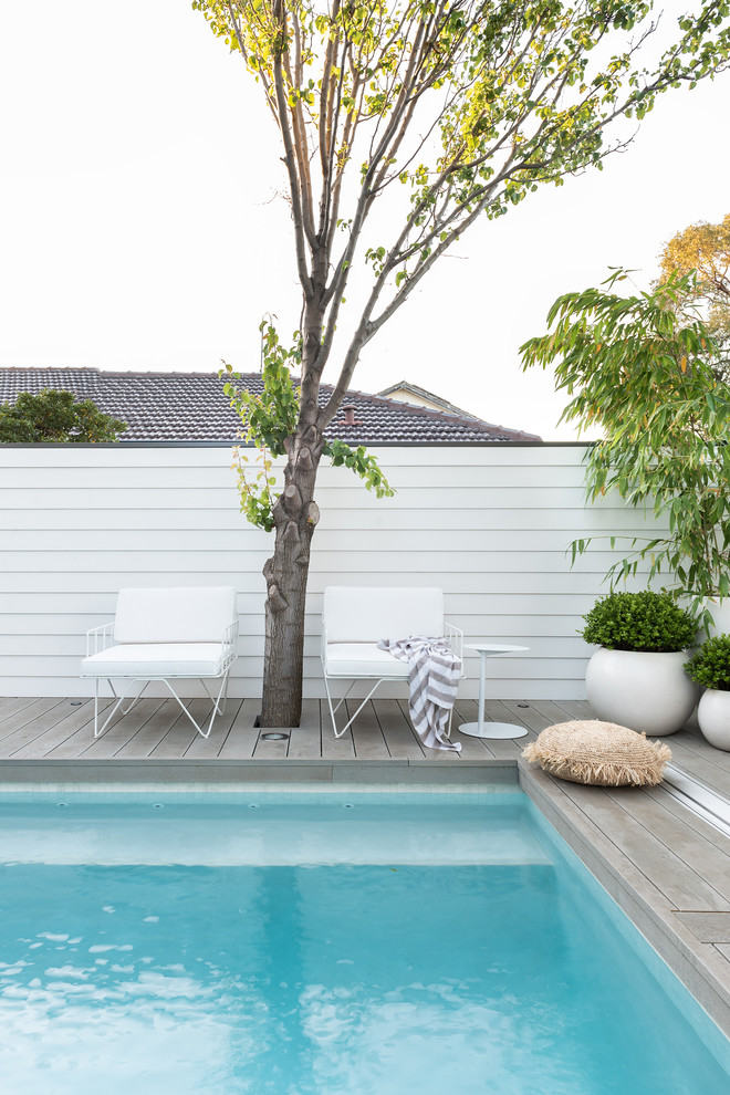 Small beach style backyard custom-shaped pool photo in Perth