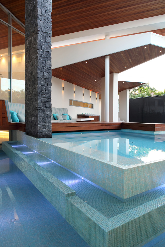 This is an example of a contemporary custom shaped swimming pool in Sunshine Coast.