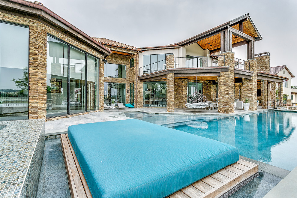 Pool fountain - modern backyard tile pool fountain idea in Dallas