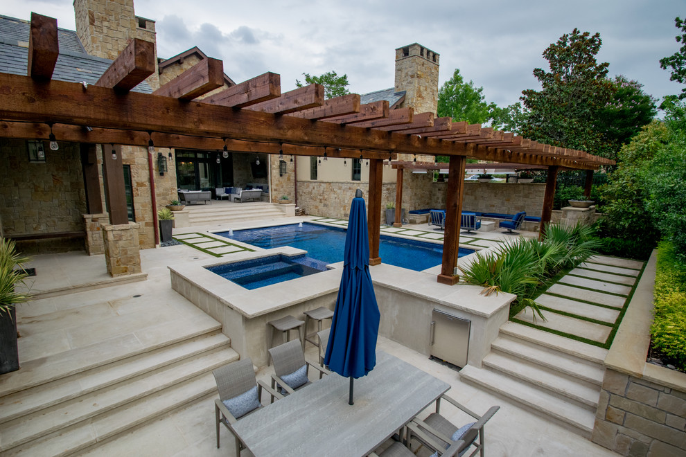 Photo of a medium sized classic back rectangular lengths swimming pool in Dallas with a water feature and natural stone paving.