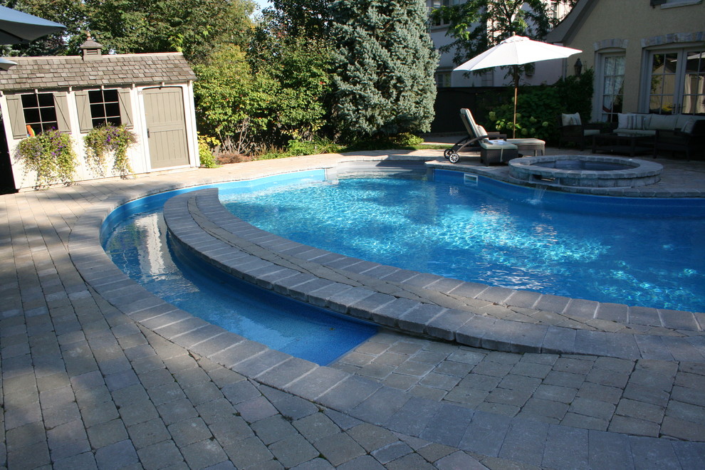 Inspiration for a traditional swimming pool in Toronto.