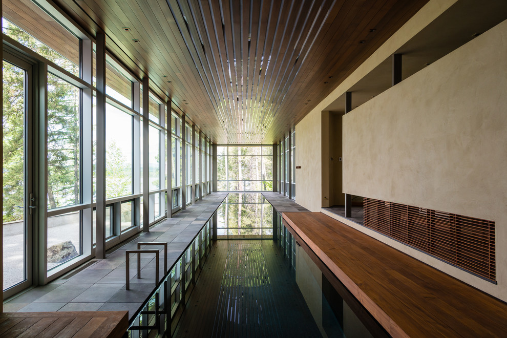 Contemporary indoor swimming pool in Other.