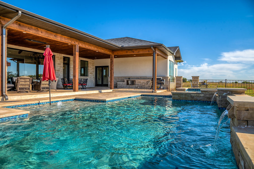 Example of a mid-sized trendy backyard concrete paver and rectangular hot tub design in Wichita