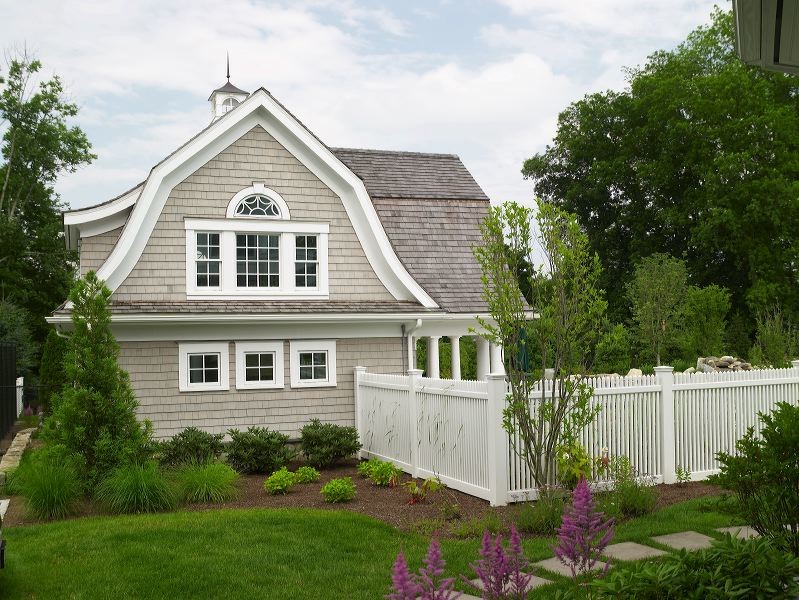 Large elegant backyard tile and custom-shaped lap pool house photo in New York