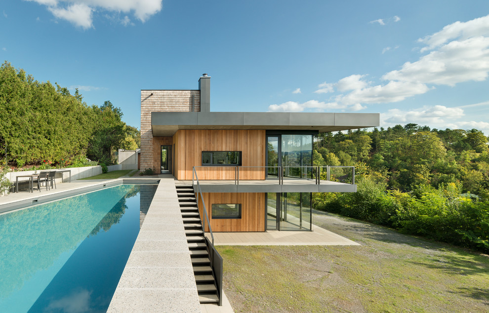Idee per una grande piscina minimalista rettangolare sul tetto
