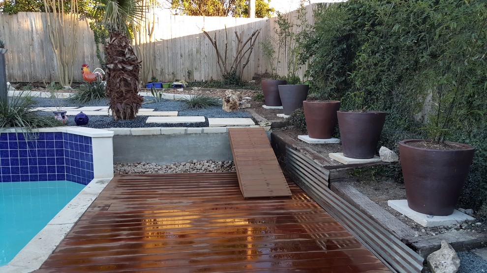 Inspiration for a medium sized contemporary back custom shaped above ground swimming pool in Austin with gravel.