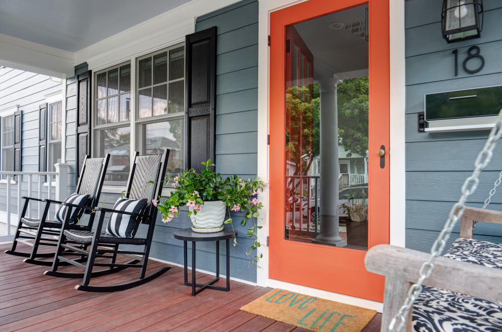 Transitional wood railing porch idea in DC Metro with decking and a roof extension