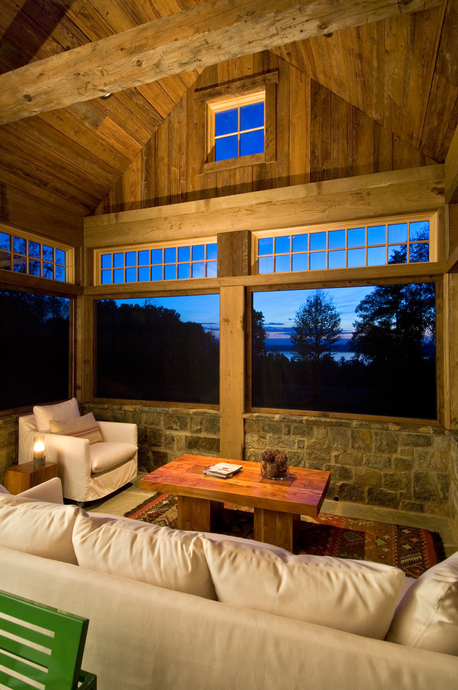 Mountain style porch photo in New York with a roof extension