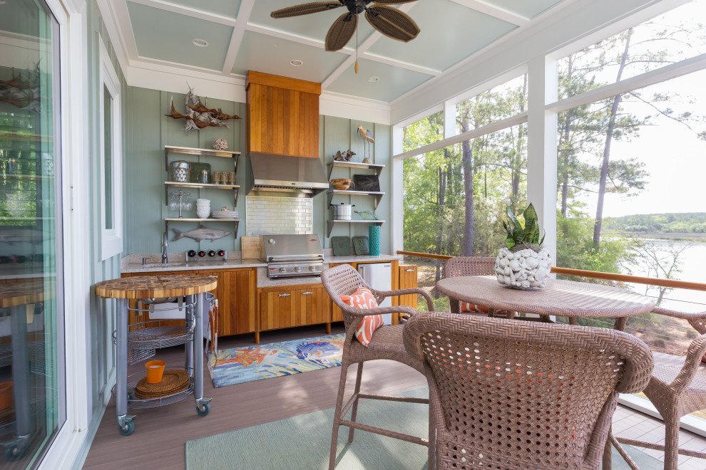 This is an example of a nautical veranda in Charleston with decking and a roof extension.