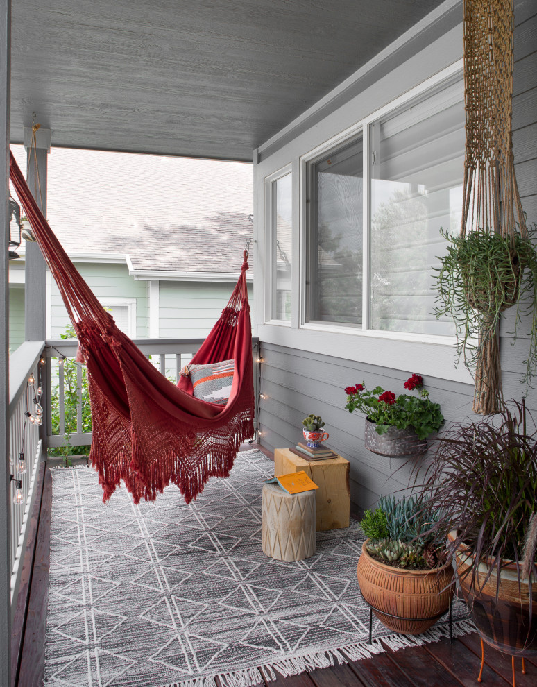 Inspiration for a small eclectic porch remodel in Denver