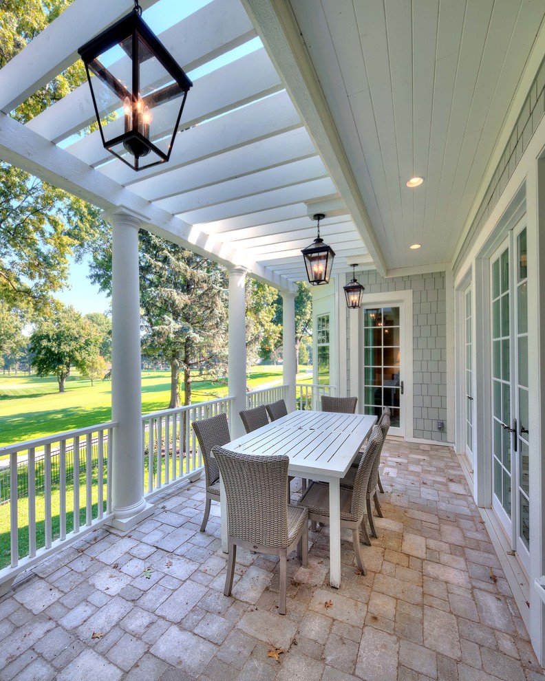 Inspiration for a classic veranda in Kansas City with feature lighting.