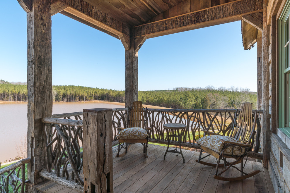 This is an example of a rustic veranda in Charlotte.