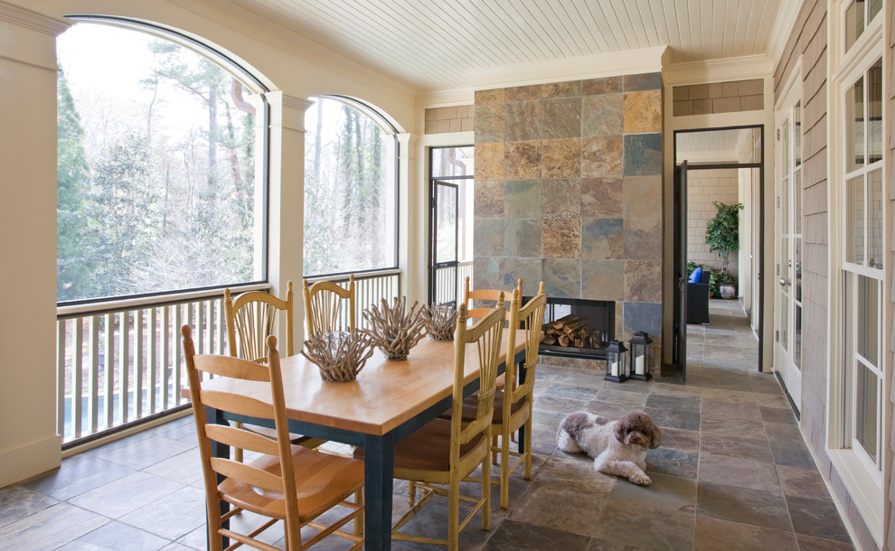 Large classic tile back porch idea in Atlanta with a fire pit and a roof extension
