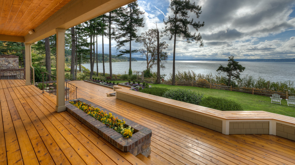 This is an example of a traditional back veranda in Seattle with decking.