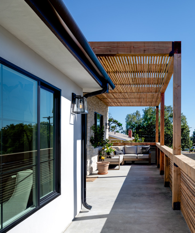 Design ideas for a mediterranean front veranda in San Diego with a pergola.