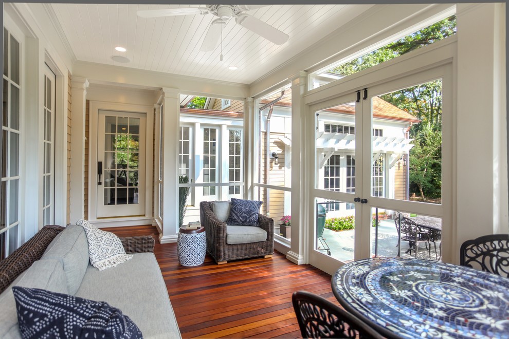 Inspiration for a medium sized classic side screened veranda in DC Metro with decking and a roof extension.