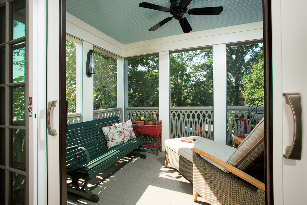 Small elegant screened-in back porch photo in DC Metro with a roof extension and decking