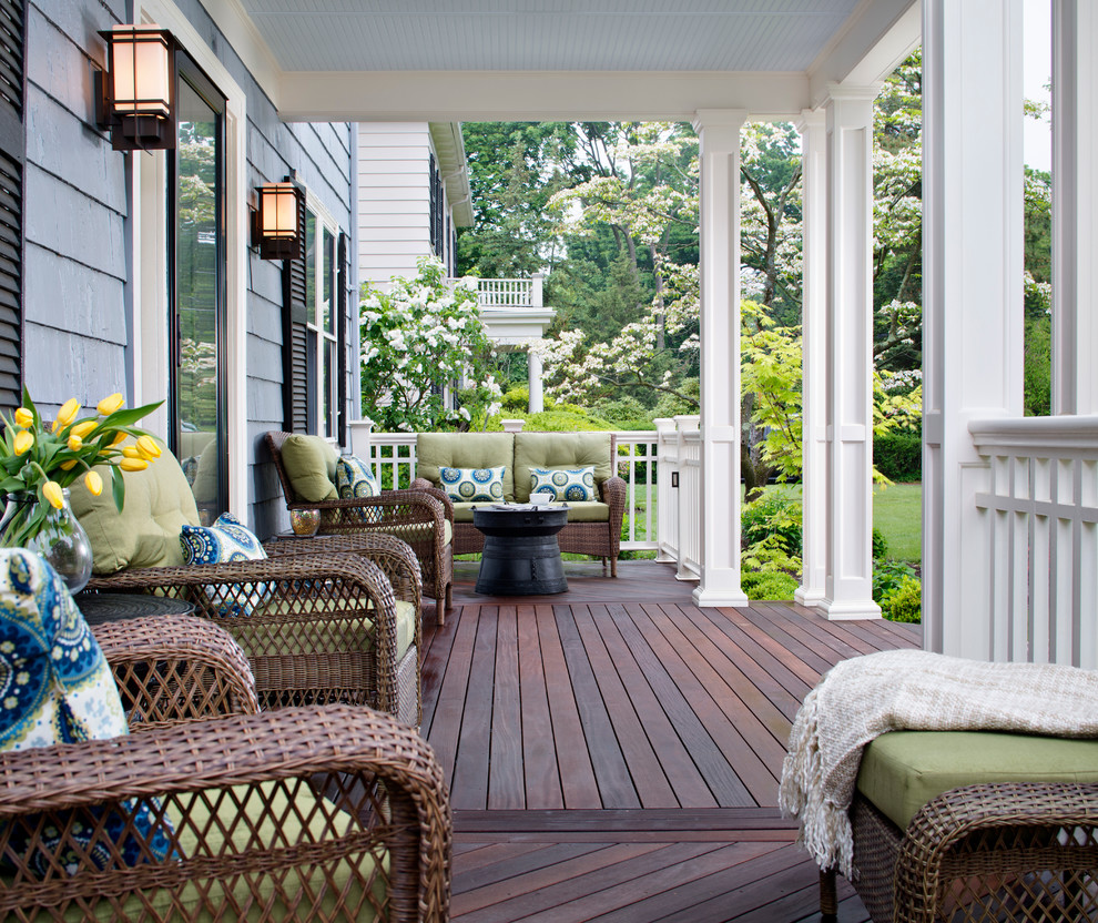 Inspiration for a timeless front porch remodel in Other with decking and a roof extension