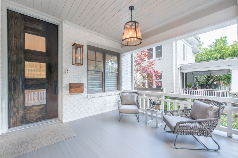 Design ideas for a classic front veranda in Atlanta with decking and a roof extension.