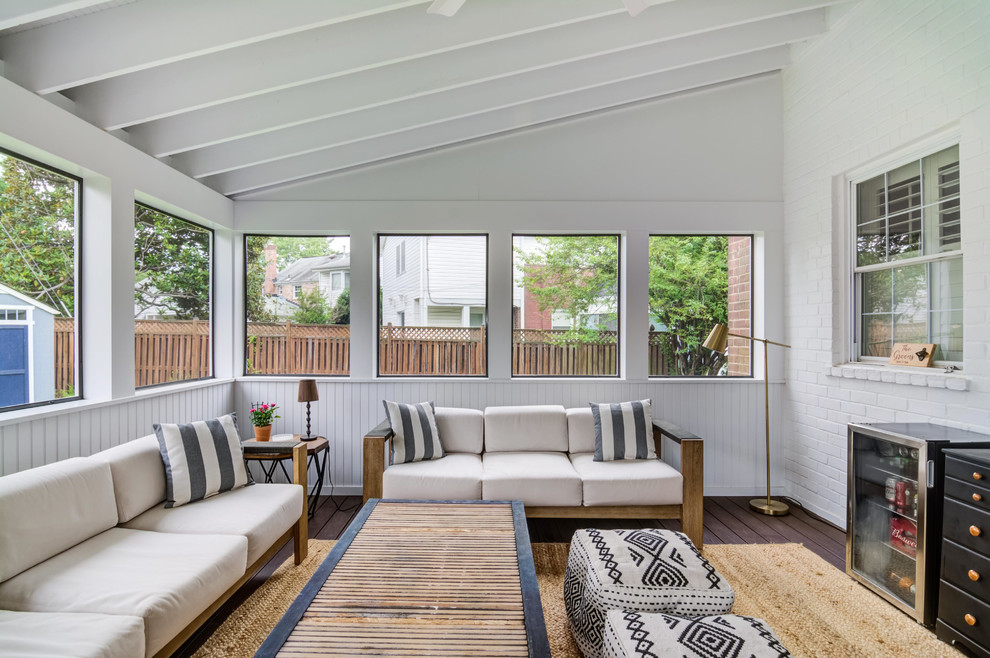 Inspiration for a mid-sized contemporary screened-in back porch remodel in DC Metro with decking and a roof extension